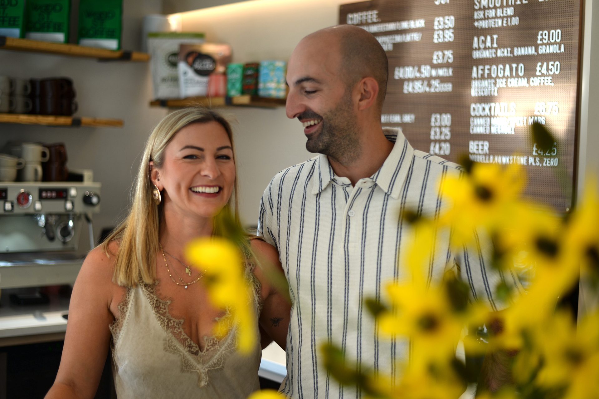 Steff and Mike smiling together inside Joy Cafe