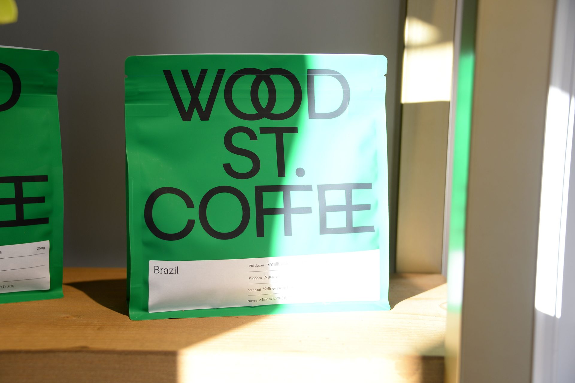 Green bags of Wood Street Coffee at Joy